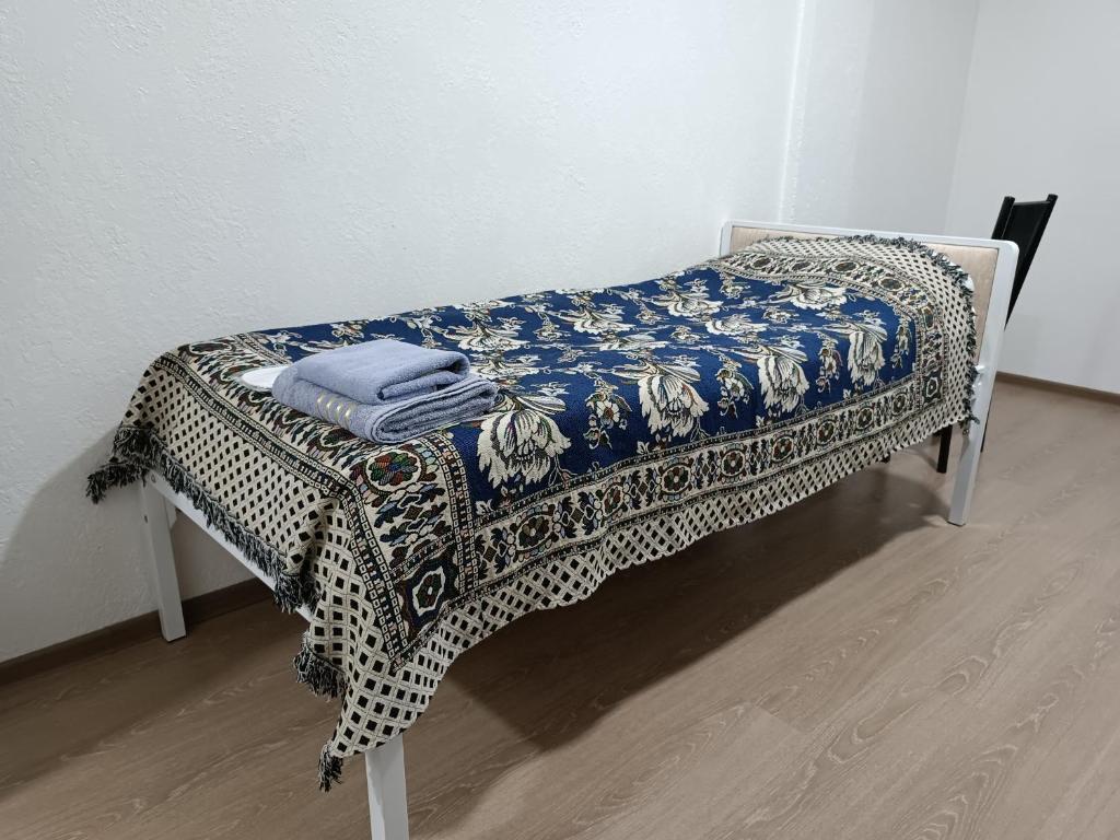 Postel nebo postele na pokoji v ubytování Nomad Inn