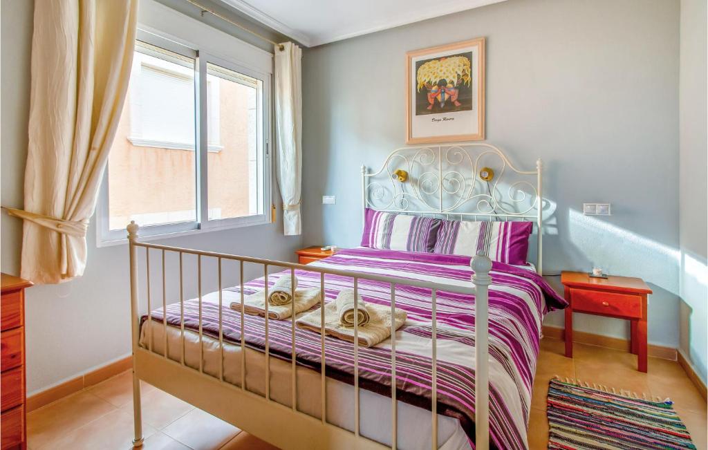 A bed or beds in a room at 3 Bedroom Cozy Home In Orihuela