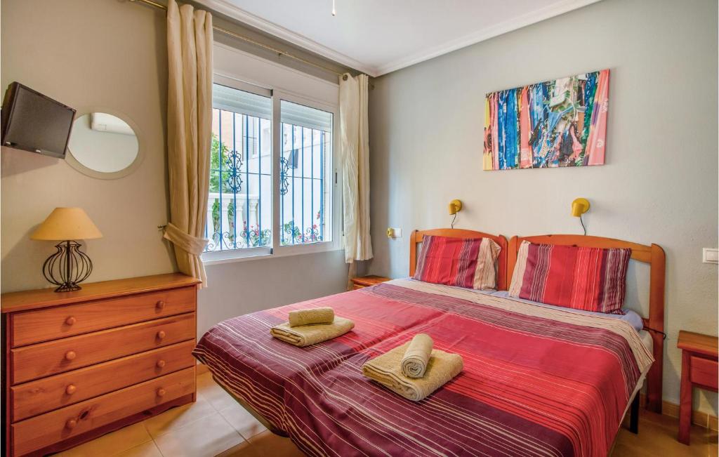 A bed or beds in a room at 3 Bedroom Cozy Home In Orihuela