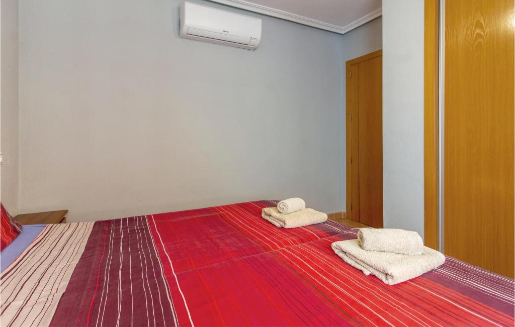 A bed or beds in a room at 3 Bedroom Cozy Home In Orihuela