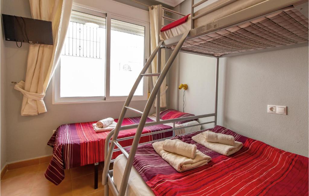 A bed or beds in a room at 3 Bedroom Cozy Home In Orihuela
