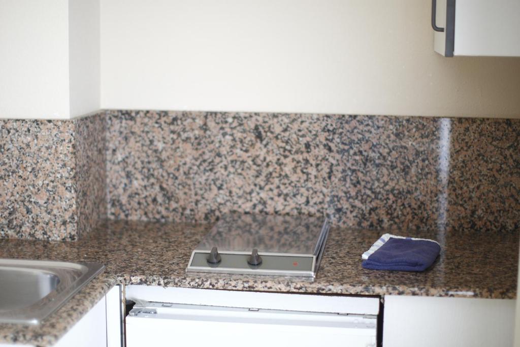 Kuchyň nebo kuchyňský kout v ubytování Hotel Rialta