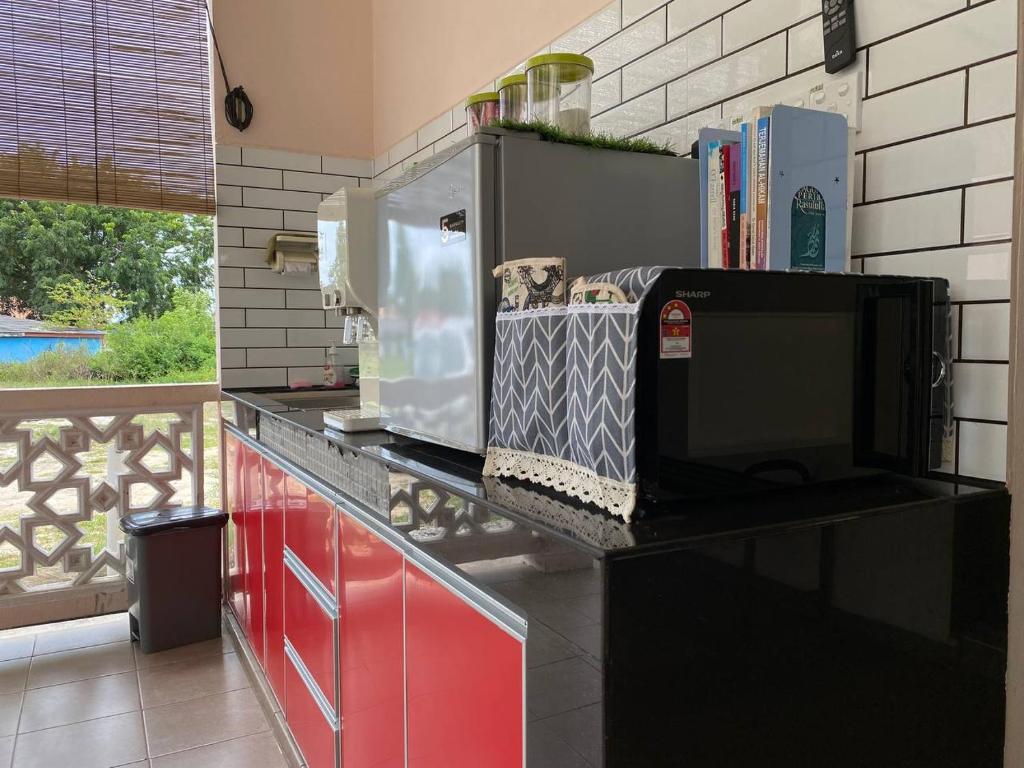 Kuchyň nebo kuchyňský kout v ubytování Besut Guesthouse