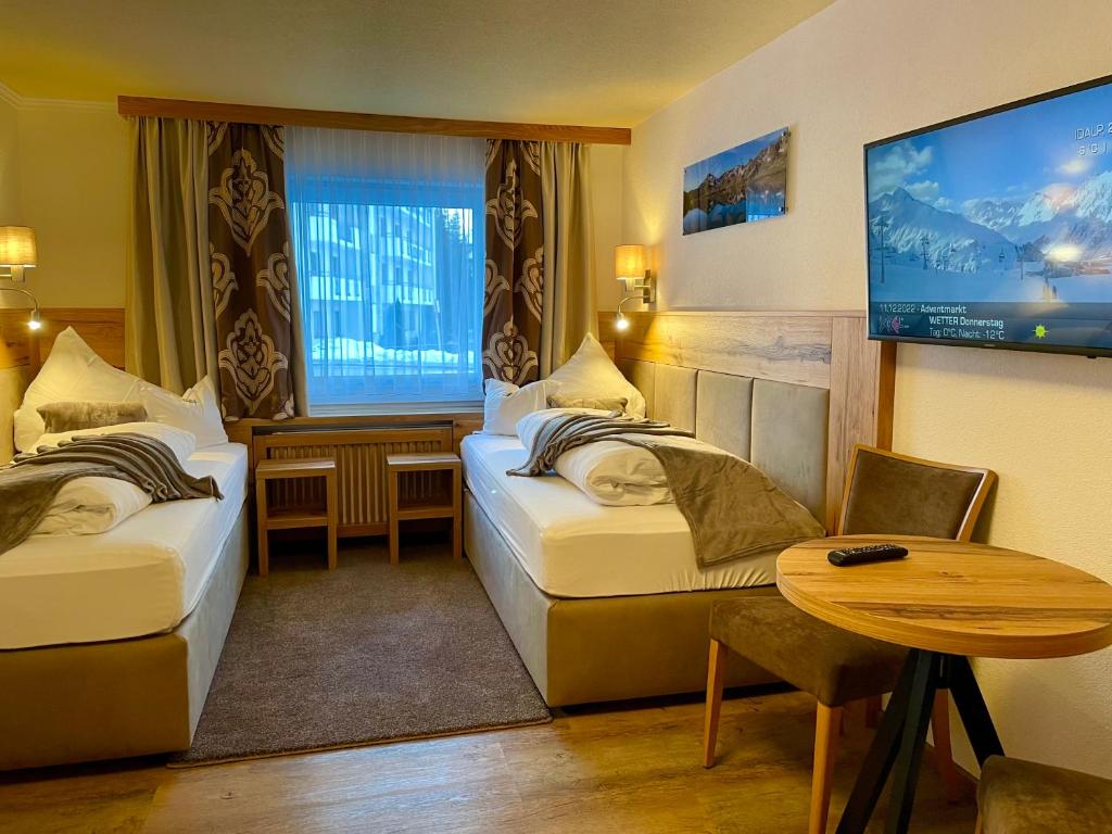 Postel nebo postele na pokoji v ubytování Hotel Vogt