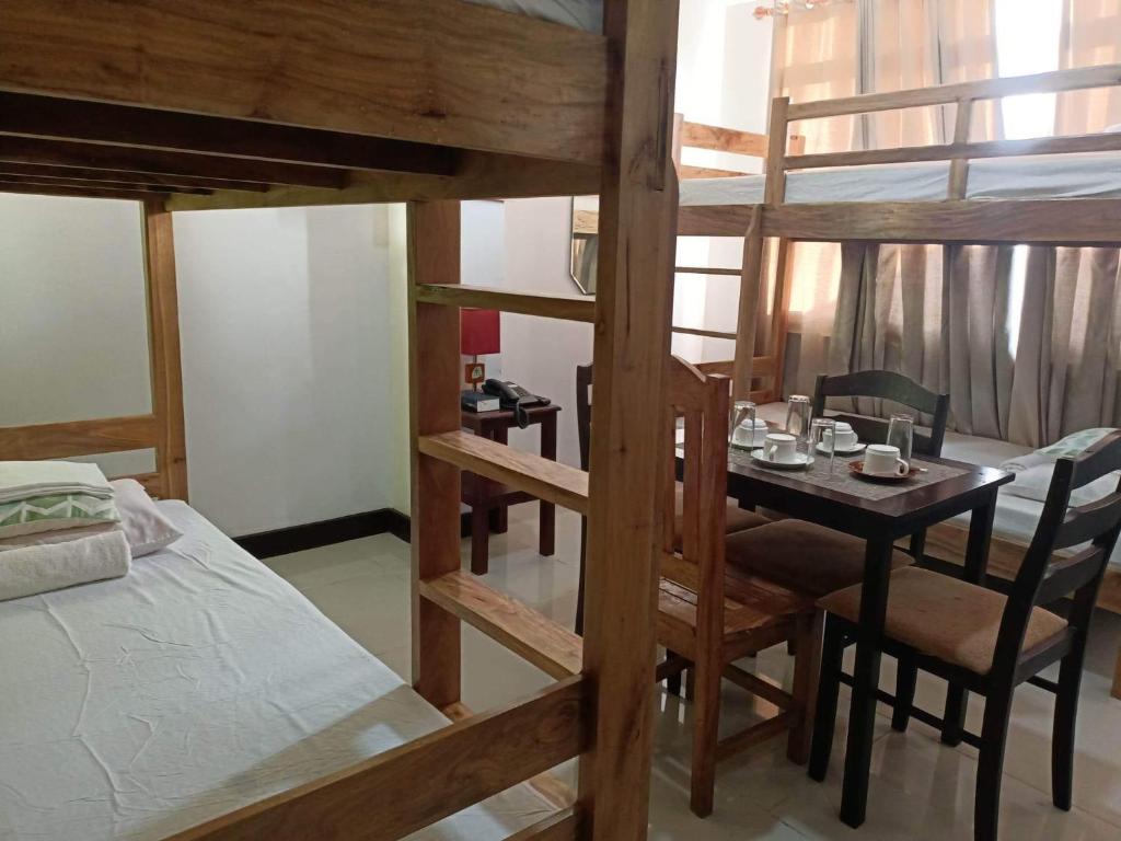 Postel nebo postele na pokoji v ubytování BOPEMPC Safari Hostel