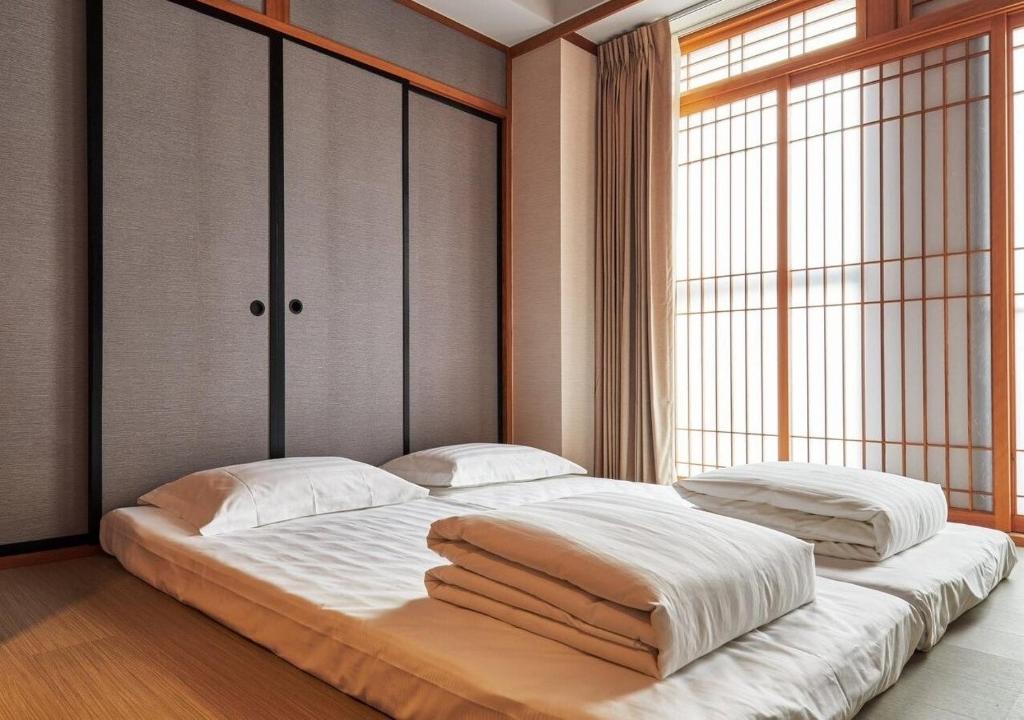 Postel nebo postele na pokoji v ubytování Lanyang Seaview Hotel