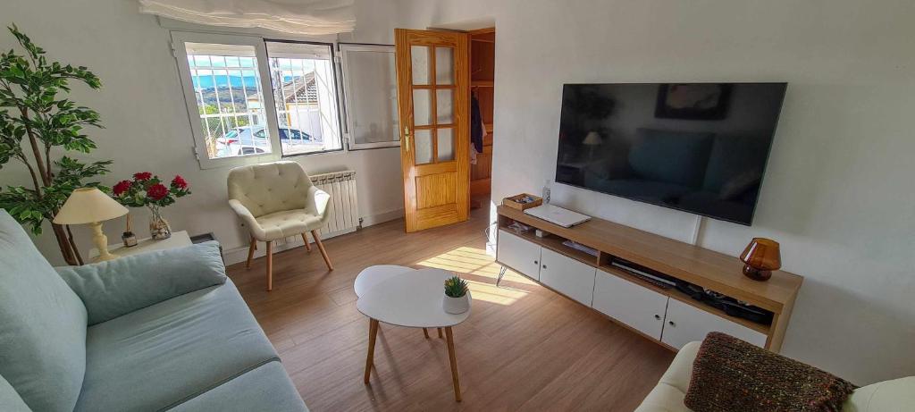 Televízia a/alebo spoločenská miestnosť v ubytovaní Casa deMáximo