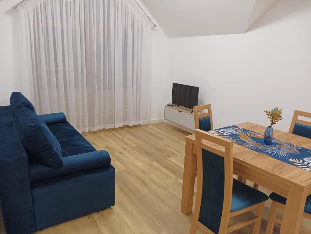 TV a/nebo společenská místnost v ubytování Apartamenty Bianka