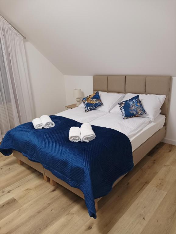 Postel nebo postele na pokoji v ubytování Apartamenty Bianka