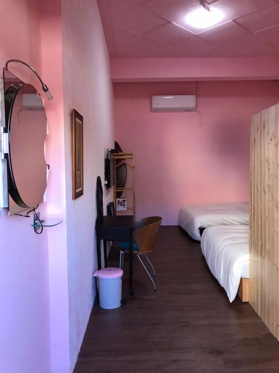 Postel nebo postele na pokoji v ubytování XingYe B&B
