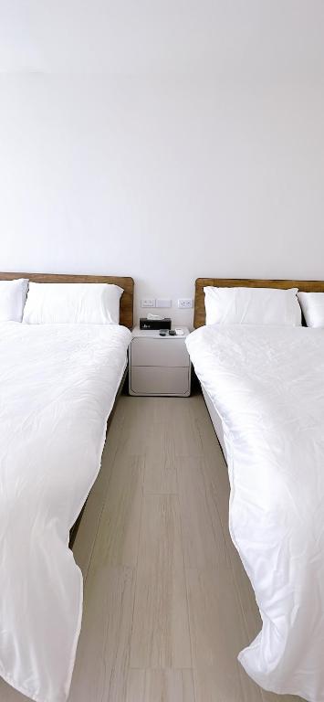 Voodi või voodid majutusasutuse 三弄旅宿3rd Alley Inn toas