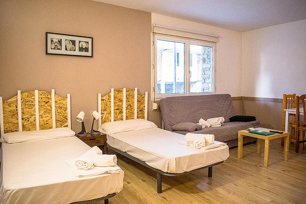 Postel nebo postele na pokoji v ubytování Estudis Turístics Cims Pas 3000