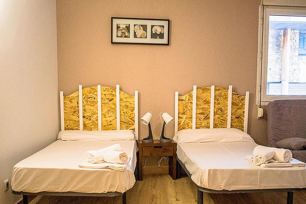 Postel nebo postele na pokoji v ubytování Estudis Turístics Cims Pas 3000