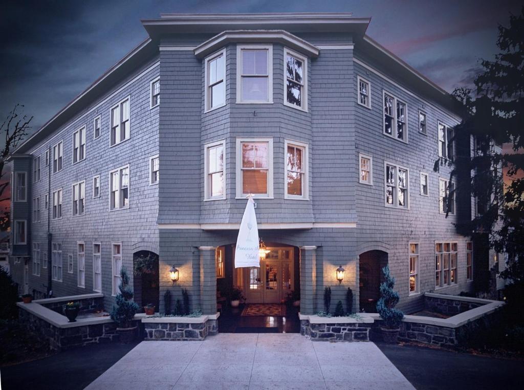 a large gray building with a front entrance at Princess Anne Boutique Hotel & Breakfast in Asheville