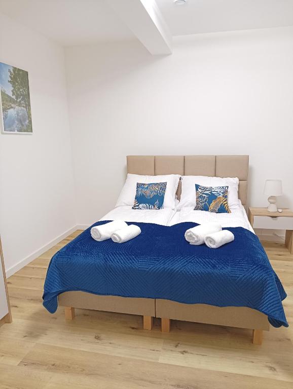 Postel nebo postele na pokoji v ubytování Apartamenty Bianka