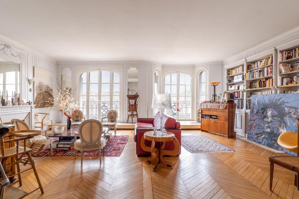 a living room with a couch and a table at Veeve - Impressions of the Eiffel Tower in Paris