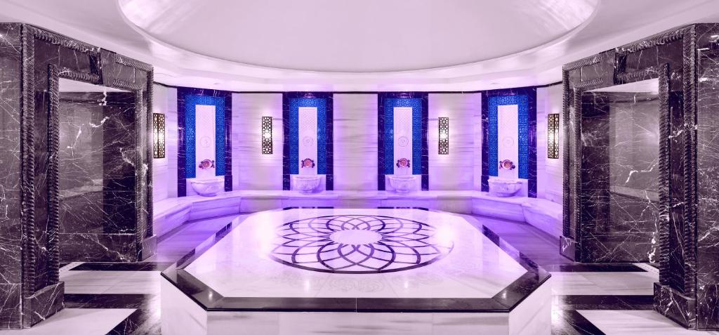 A bed or beds in a room at The Green Park Pendik