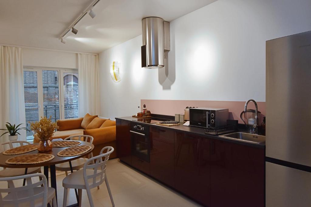 Kuchyň nebo kuchyňský kout v ubytování Apartamenty Na Tatarskiej 4A