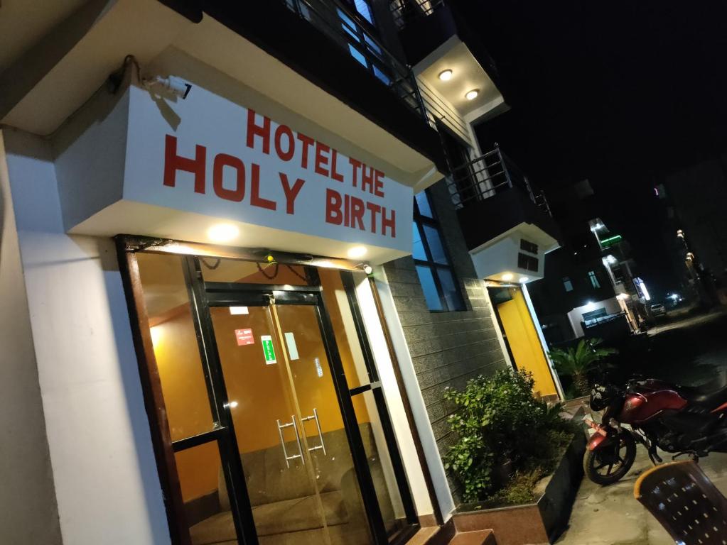 a hotel entrance with a sign that reads hotel the holy birth at Hotel The Holy Birth in Rummindei