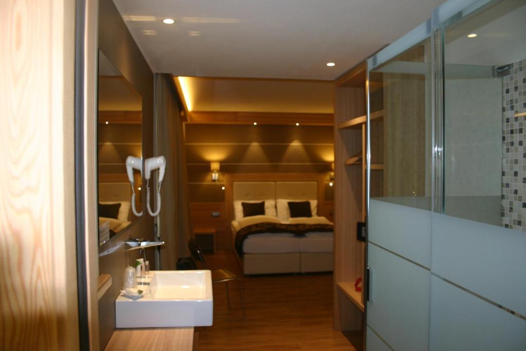 Postel nebo postele na pokoji v ubytování Hotel Bondi