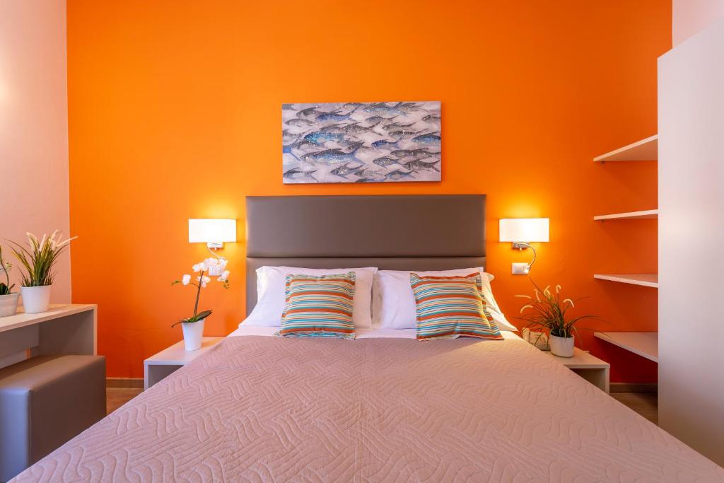 A bed or beds in a room at Hotel Romagna