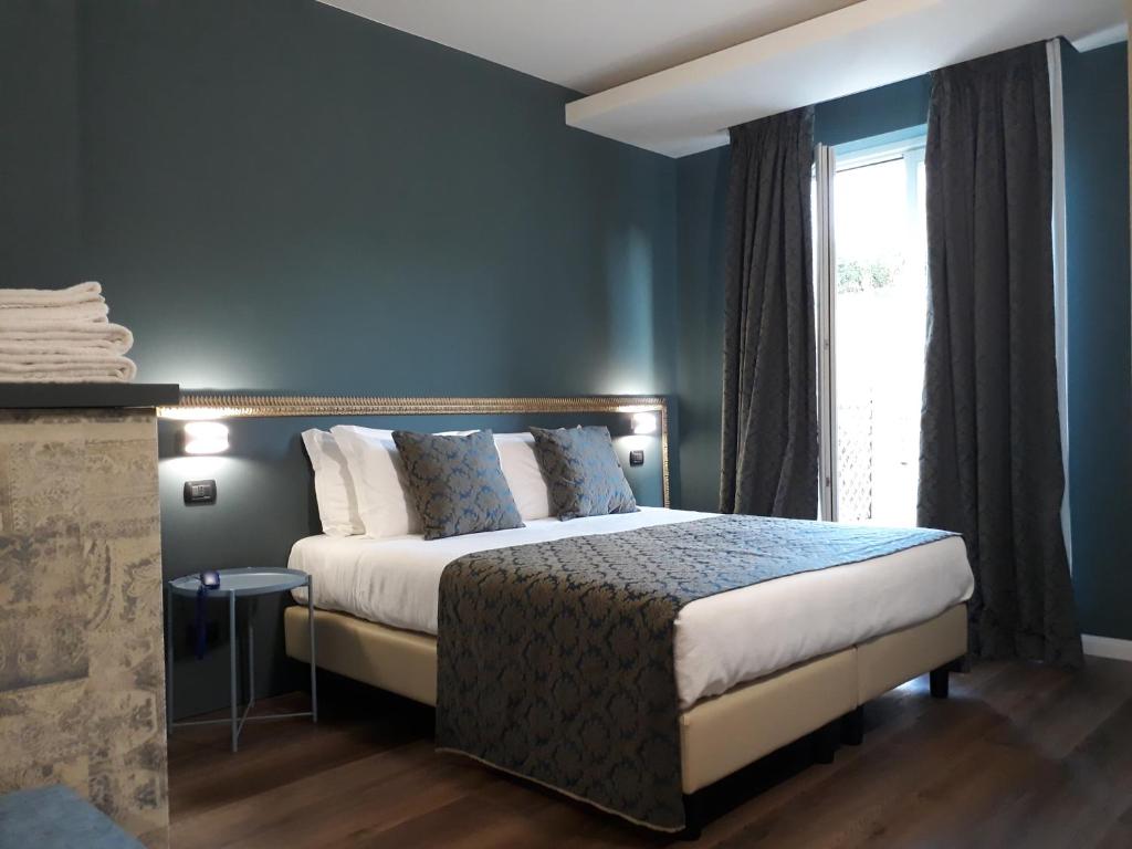 A bed or beds in a room at Resort Limax Acis