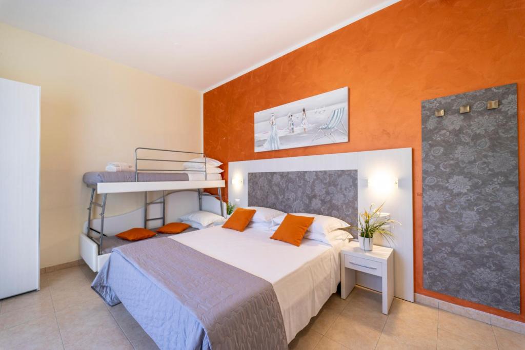 A bed or beds in a room at Hotel Romagna