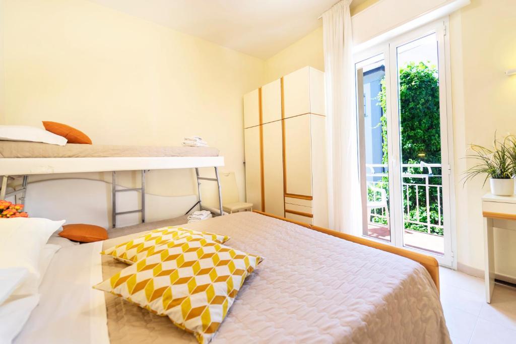 A bed or beds in a room at Hotel Romagna