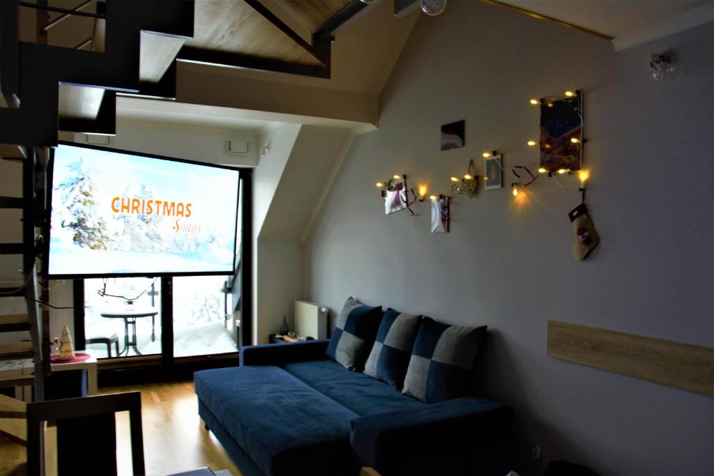 Posezení v ubytování My Universe Energy Apartment Tęczowe Wzgórze