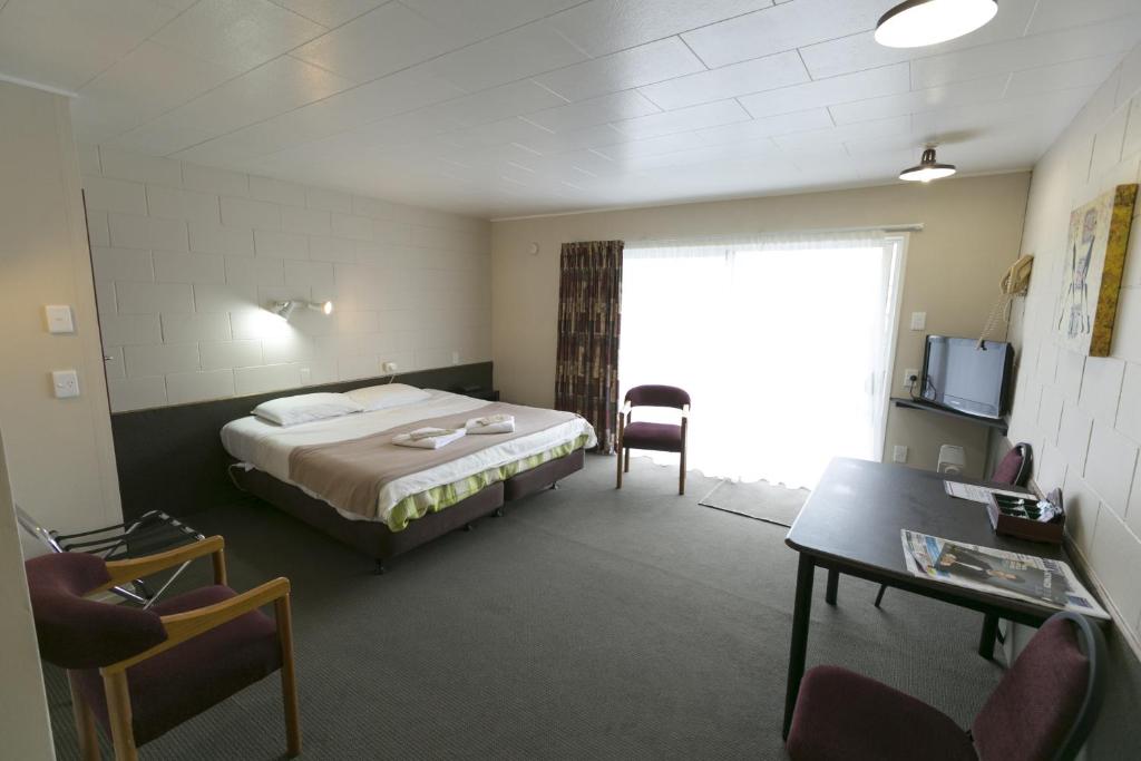 Postel nebo postele na pokoji v ubytování Maple Lodge Motel
