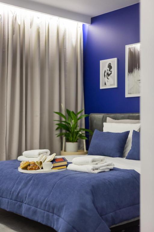 Posteľ alebo postele v izbe v ubytovaní Family Center Apartments