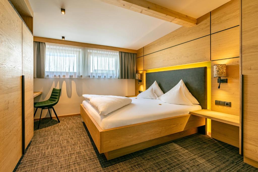 Posteľ alebo postele v izbe v ubytovaní Kräuterhotel Hochzillertal