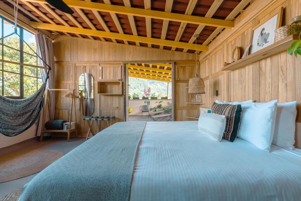 Postel nebo postele na pokoji v ubytování Hotel Plantación