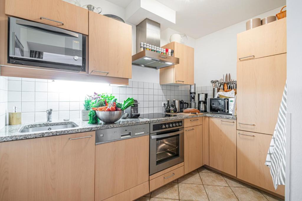 A kitchen or kitchenette at Panorama & SPA Apartment Kaiser Franz Josef I im Schillerhof