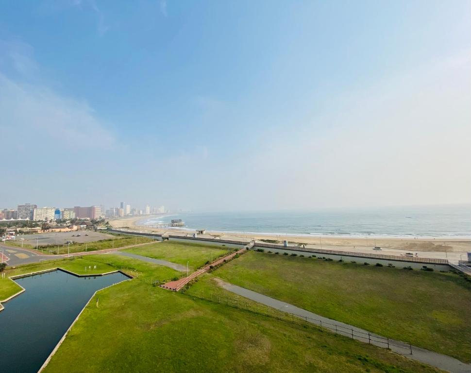 an aerial view of the beach and the ocean at The Waves, 806 Quayside Point Waterfront in Durban