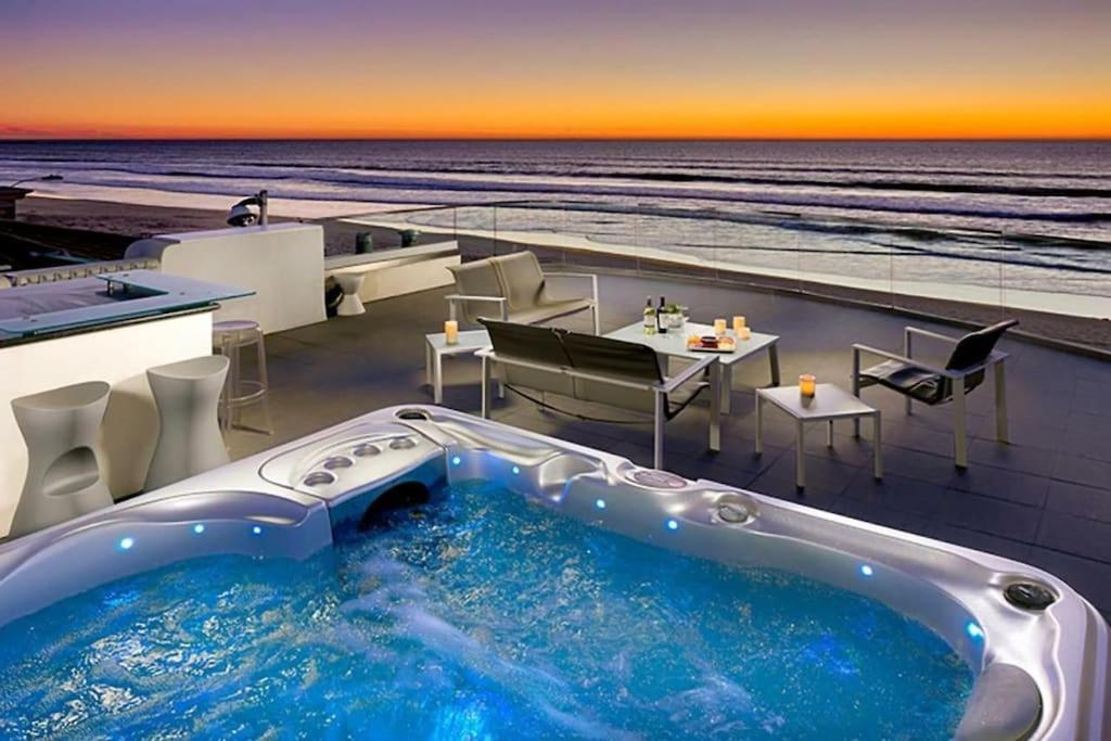 a hot tub on a building with a view of the ocean at Crown Jewel in Mission Beach at Ocean Front Walk in San Diego