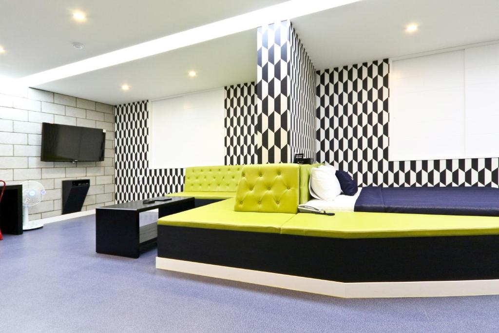 TV a/nebo společenská místnost v ubytování Hotel Home