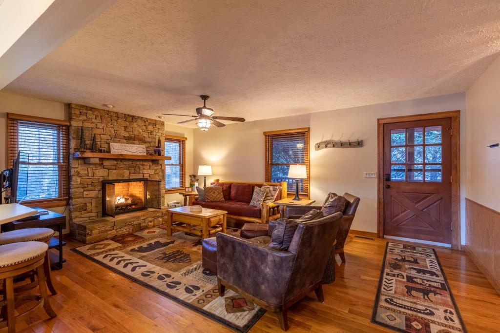 a living room with a couch and a fireplace at Nuttin' Better in Blowing Rock