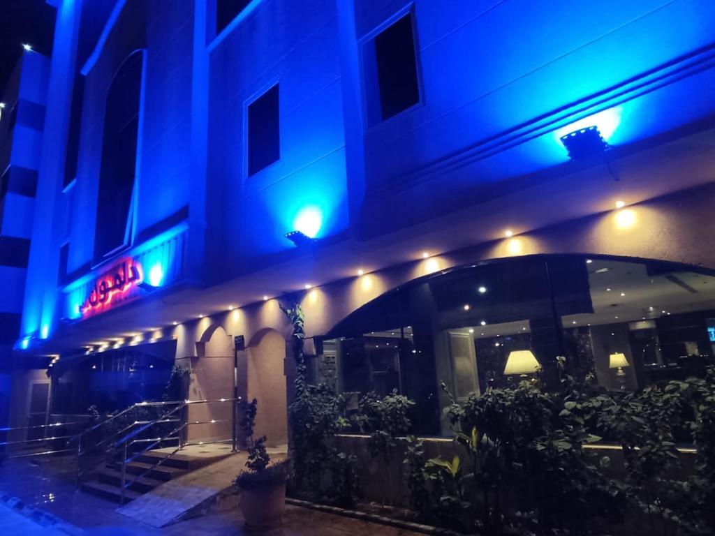a building with blue lights on the side of it at Gulf Delmon in Dammam