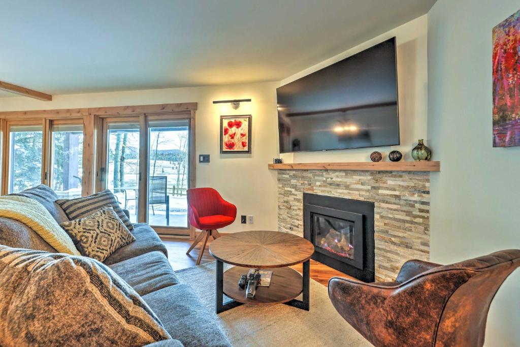 a living room with a couch and a fireplace at MtnandLake Views and 3 Mi to Skiing Dillon Condo in Dillon