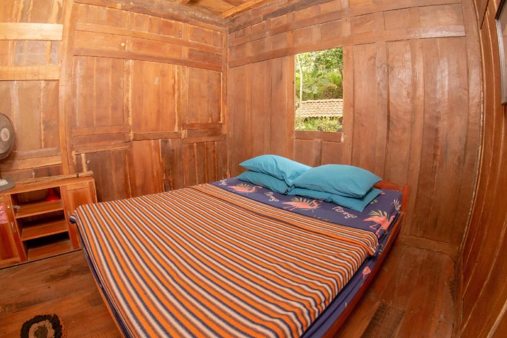 Postel nebo postele na pokoji v ubytování Villa Kampung Ayem Riverside