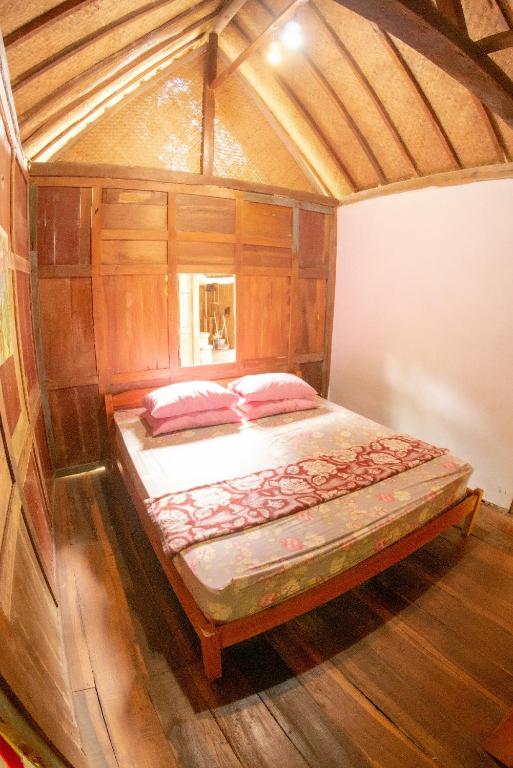 Postel nebo postele na pokoji v ubytování Villa Kampung Ayem Riverside