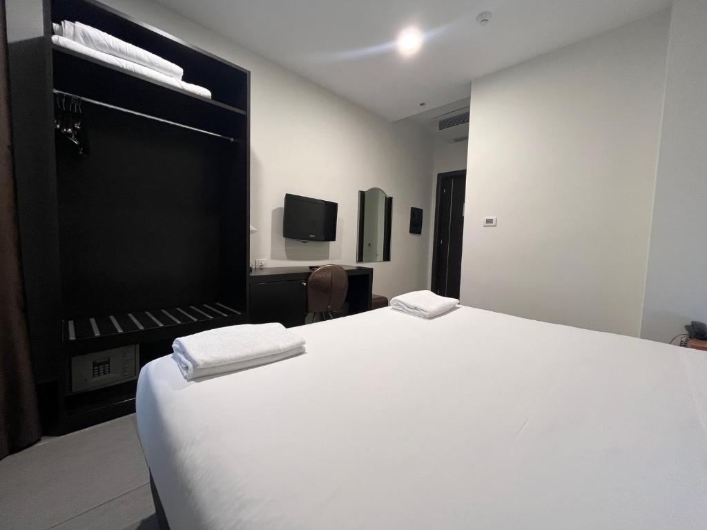 Postel nebo postele na pokoji v ubytování Napolit'amo Hotel Medina