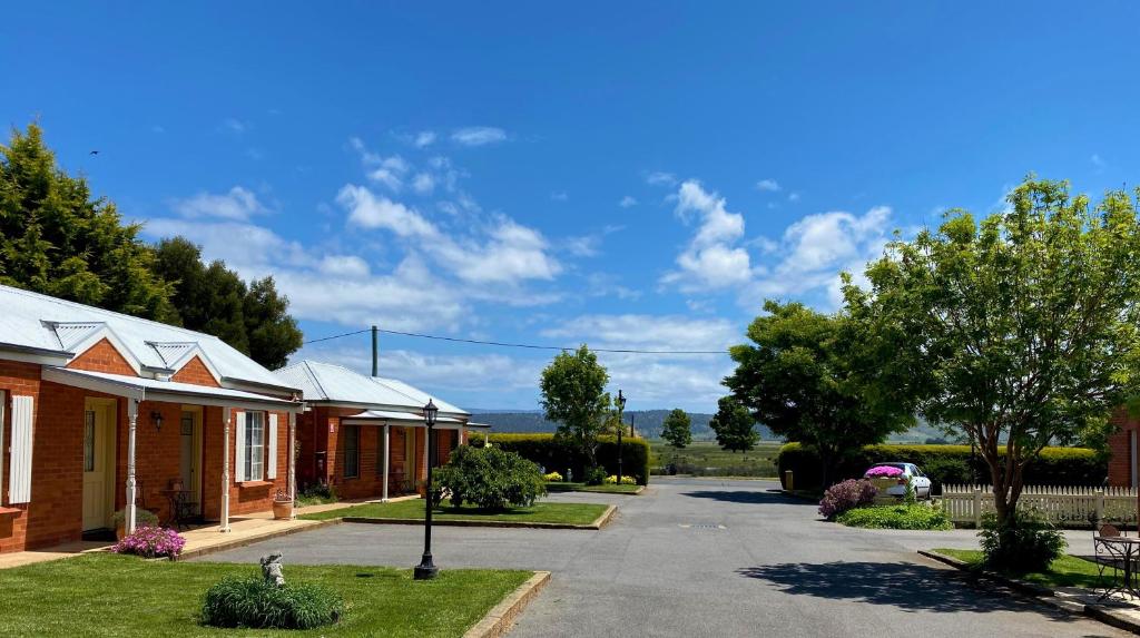 a house with a driveway next to a building at Riverview at Ross in Ross