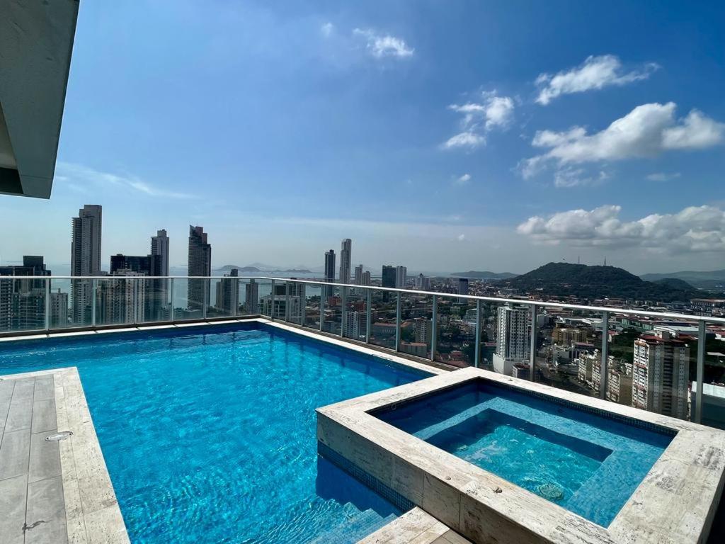 a swimming pool on top of a building at Signature Point Bella Vista, Sea View 2 BR in Panama City