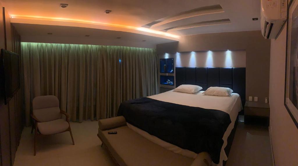 En eller flere senge i et værelse på Mansão Fragata