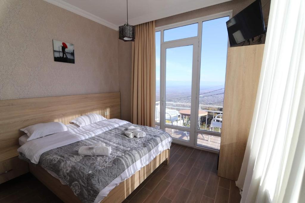 Postel nebo postele na pokoji v ubytování Guest House Alazani Valley