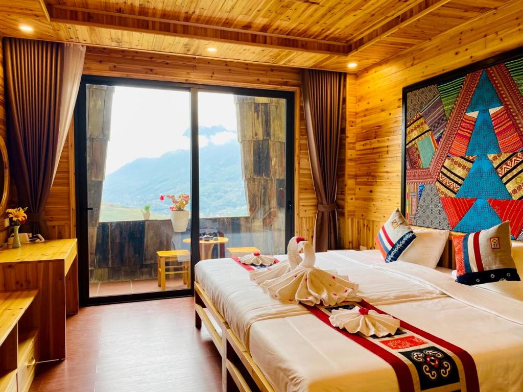 Giường trong phòng chung tại Arista Homestay