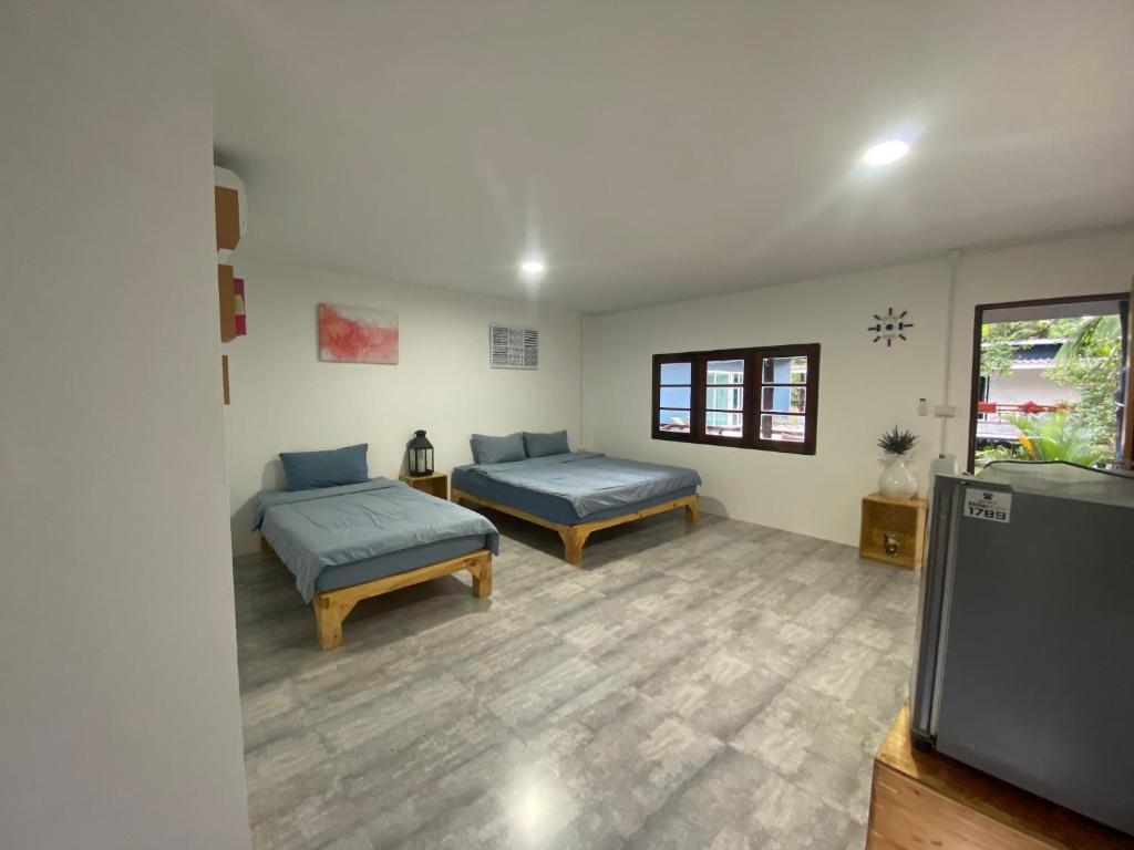 Postel nebo postele na pokoji v ubytování PD Guesthouse