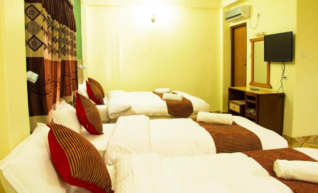 Cama o camas de una habitación en Hotel Adam